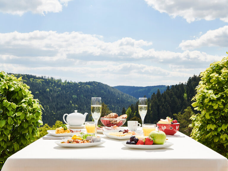 richly laid breakfast table in the Hotel Berlins KroneLamm with a great view of the Black Forest