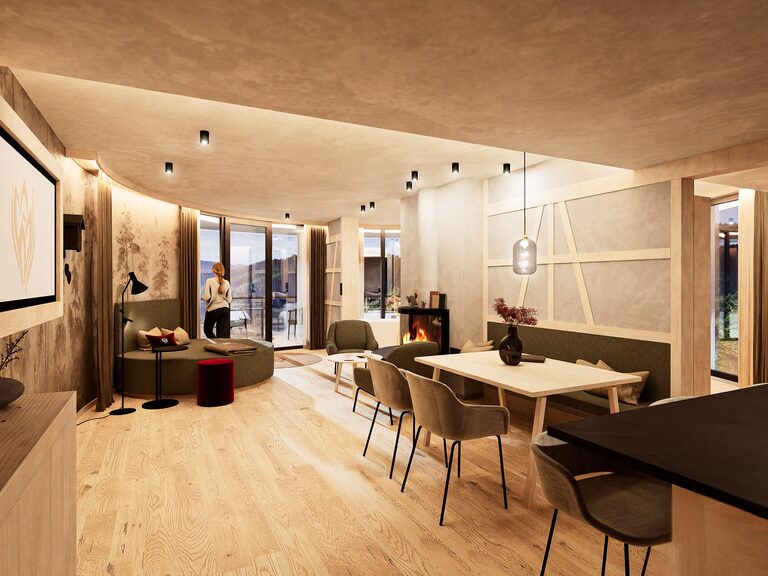Hideaway Suite mit Panoramablick Wohnbereich der Hideaway Suite mit runder Couch und Designkamin